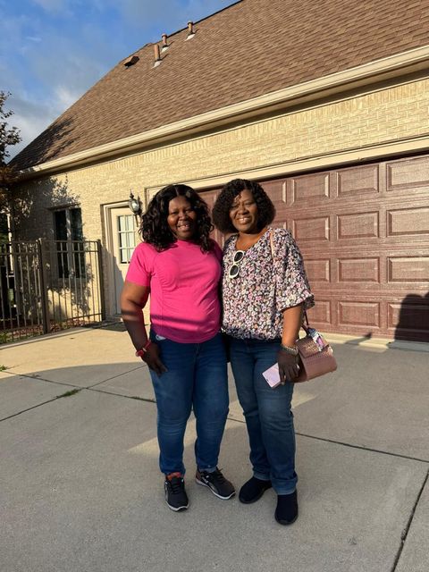 Two friends outside the house